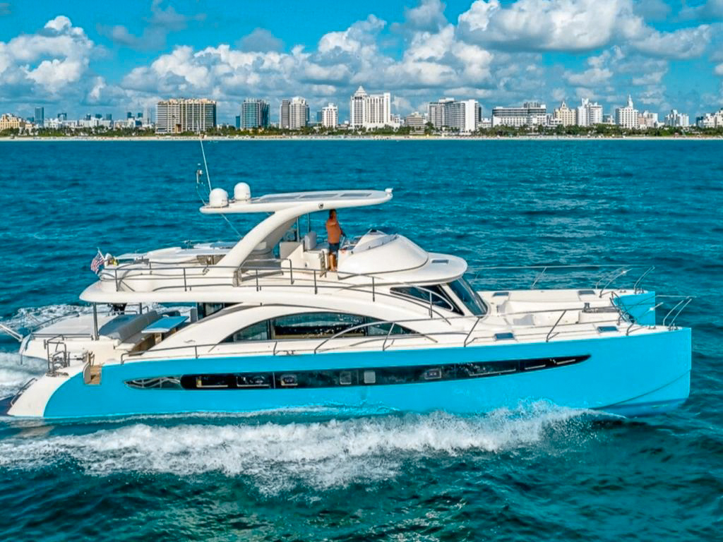 Side view of the 62 Power Cat II catamaran sailing in Miami