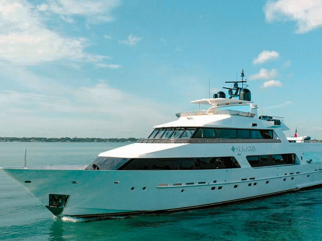 Luxury 125ft Heesen yacht sailing in the clear blue waters of The Bahamas during a charter.