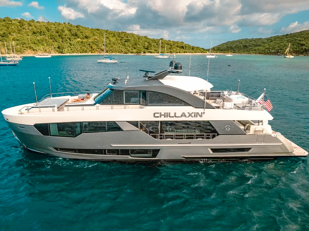 Side view of the 90 Ocean Alexander yacht cruising in The Bahamas