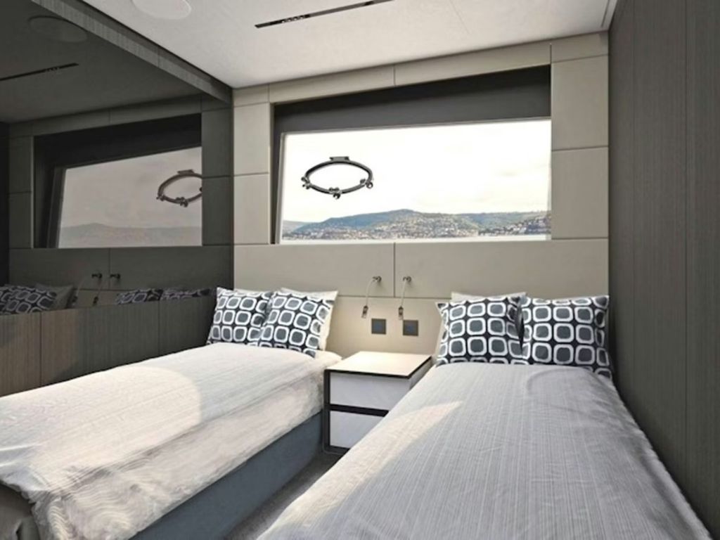 Guest cabin on the 116 Pershing yacht with modern decor