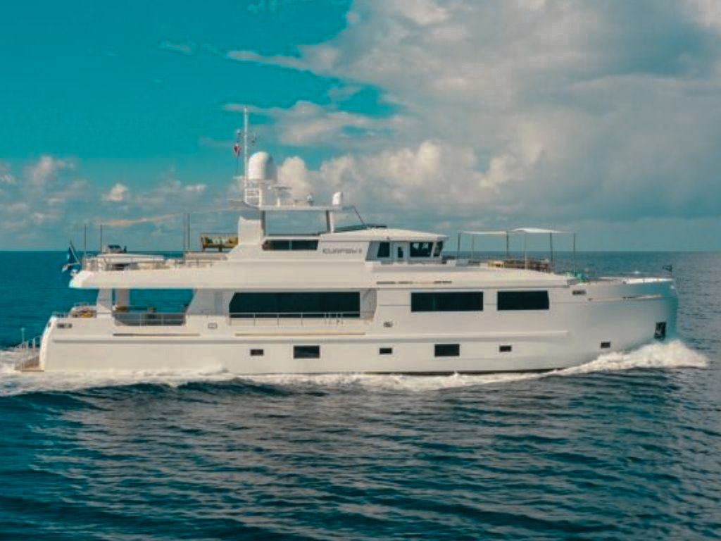 Luxury 104ft Mengi Yay yacht for charter sailing in the crystal-clear waters of The Bahamas.