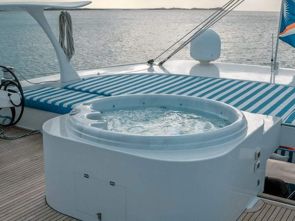 Guests relaxing on the bow of the 104ft Mengi Yay yacht