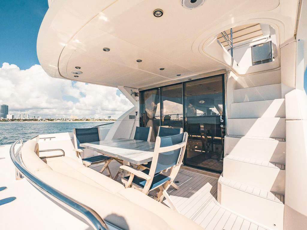 Stern view of 70 Sunseeker II with guests enjoying the sunpad