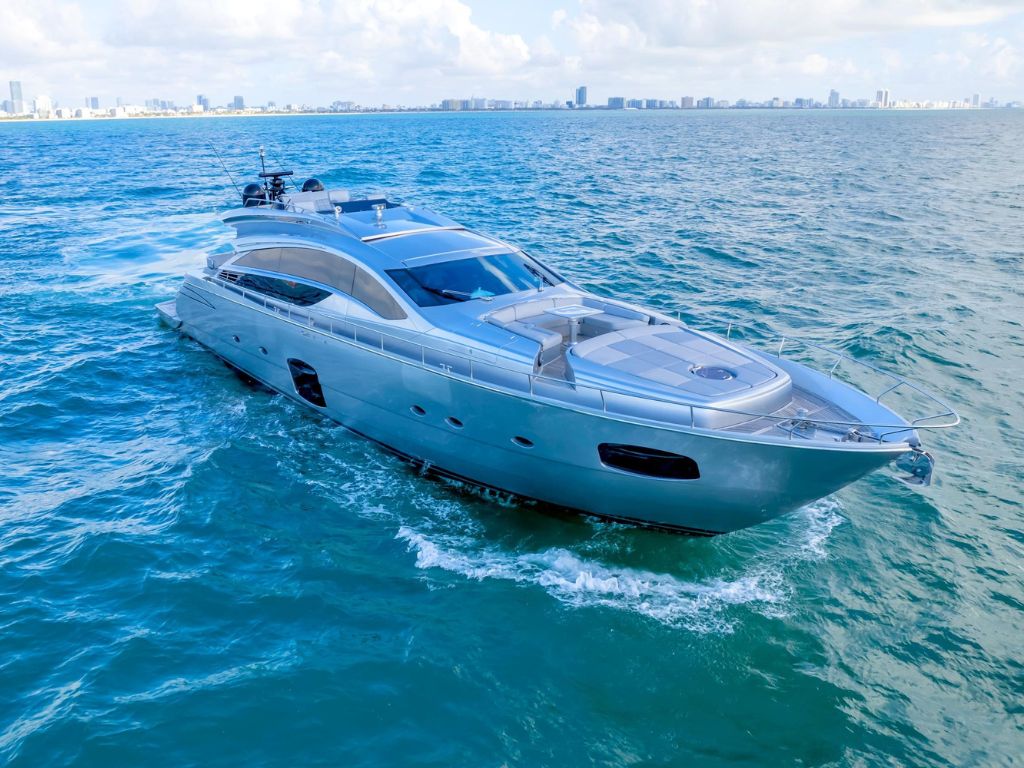 Luxurious 82ft Pershing yacht cruising in Miami waters for charter.
