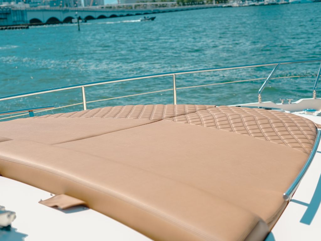 Back deck of 70 Aicon yacht with table and seating
