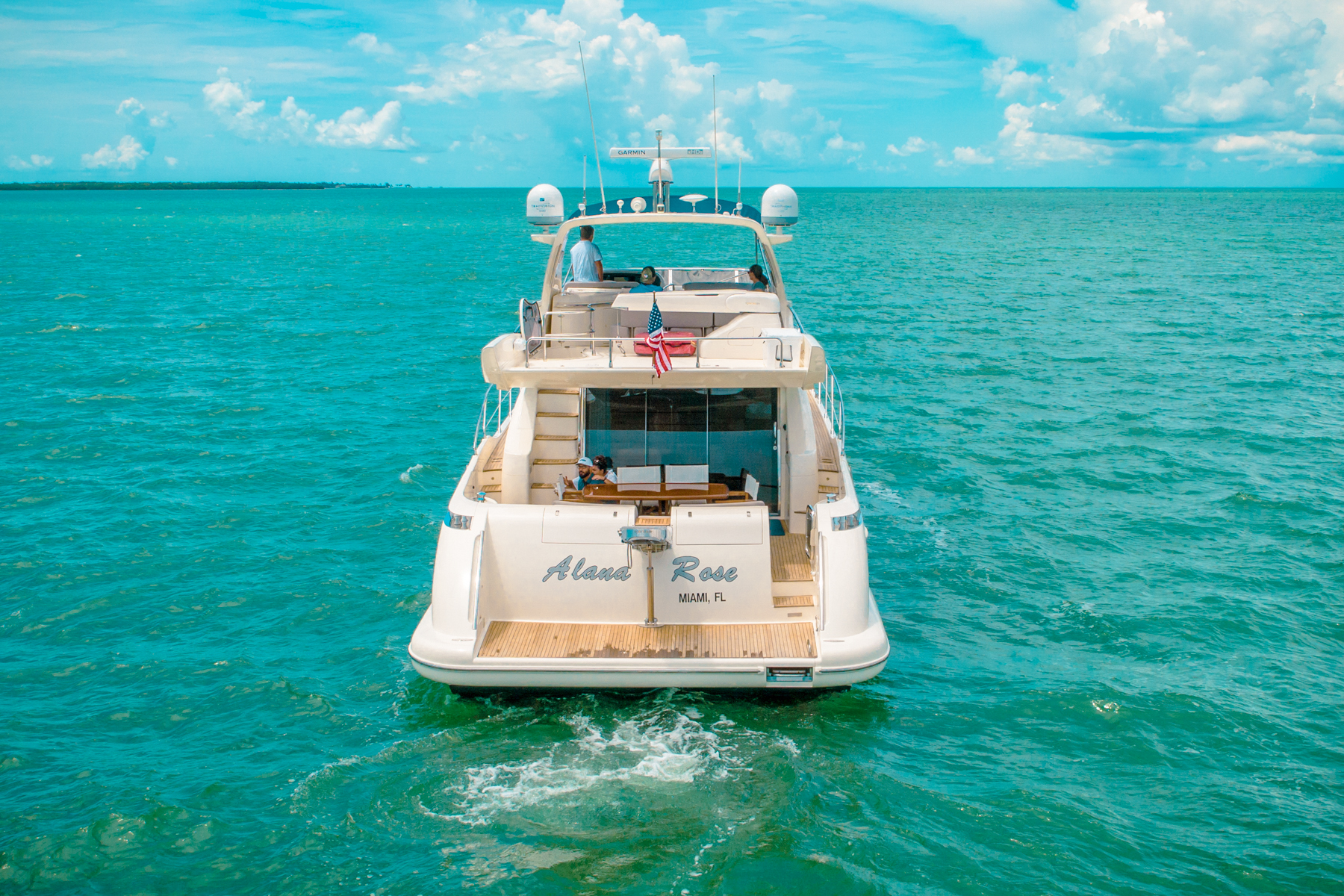 Aft deck of 62 Azimut IV with dining table and seating