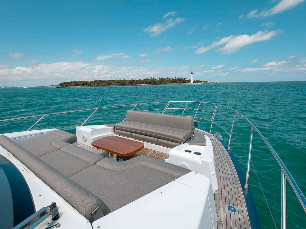 A woman relaxing on the bow of the 60 Azimut II yacht in Miami