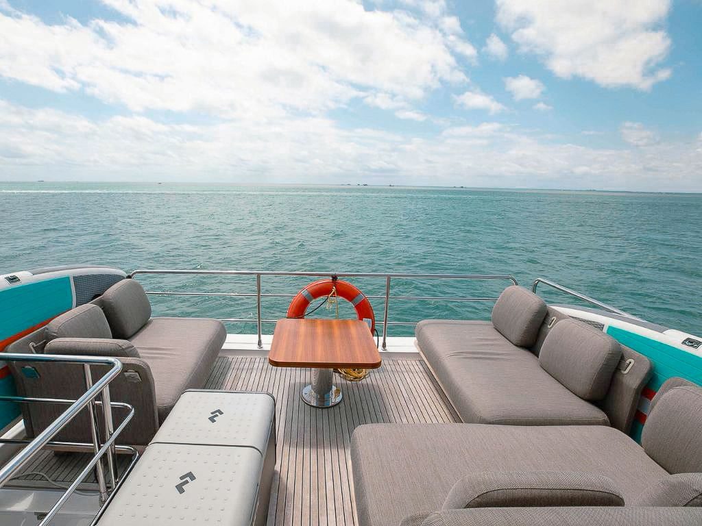 A group enjoying the deck of the 60 Azimut II yacht in Miami