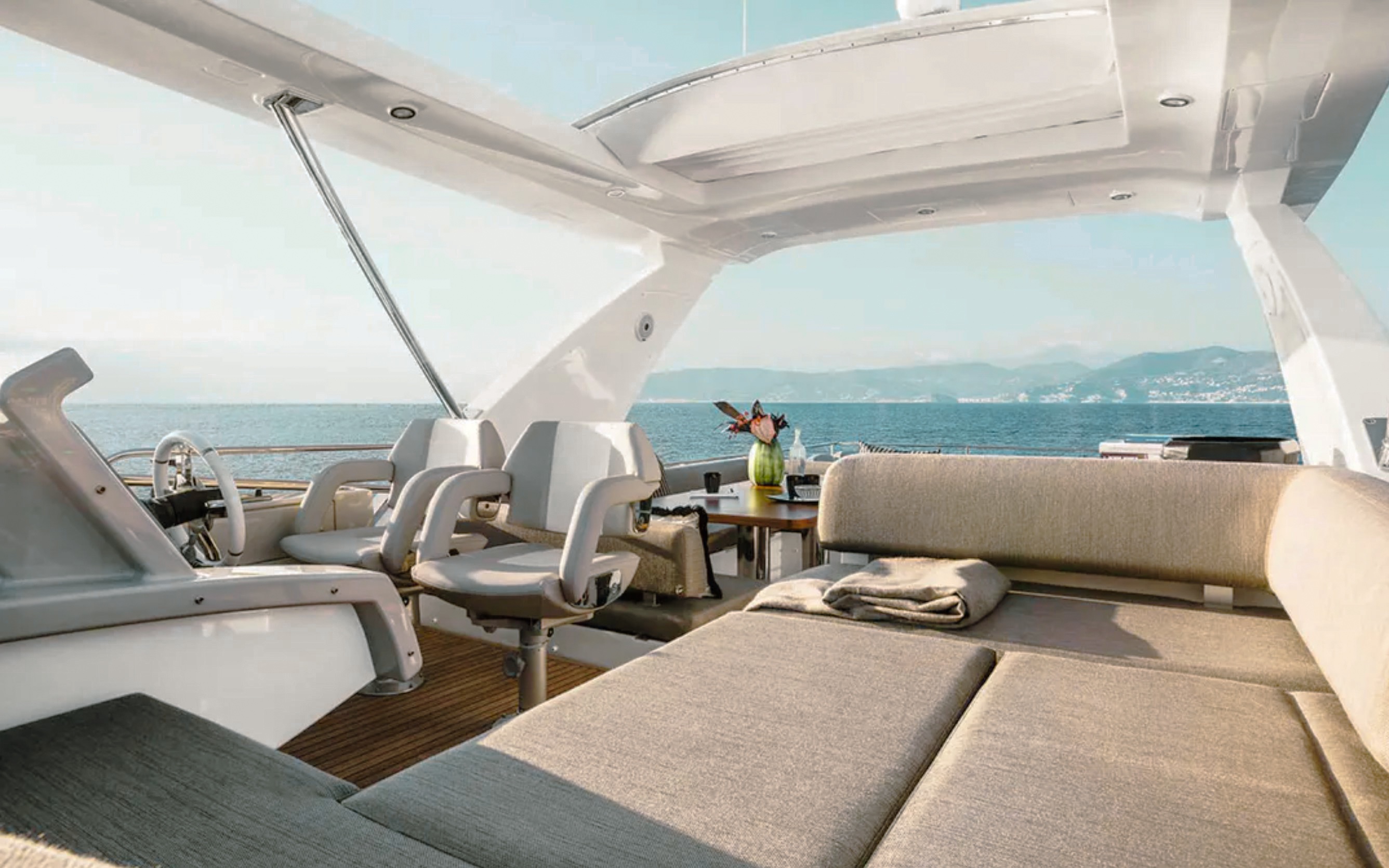 Rear deck view of 68 Azimut III yacht with seating