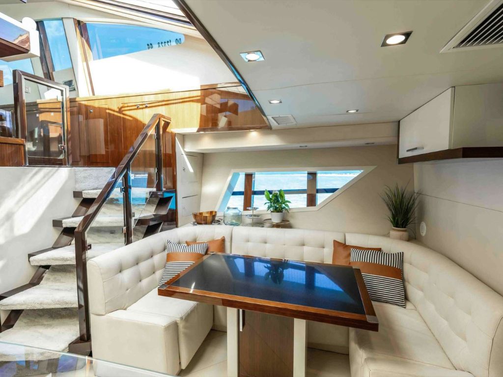 A person using the waterslide from the 92 Lazarra yacht into the ocean