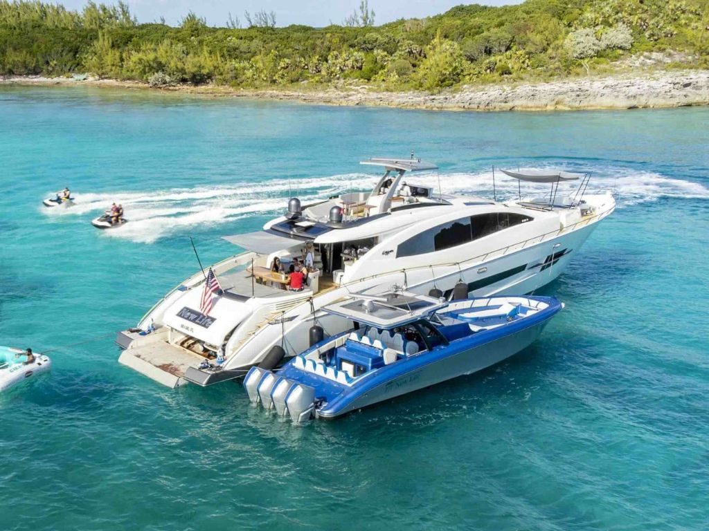 Luxury 92ft Lazzara yacht cruising in crystal clear waters of the Bahamas