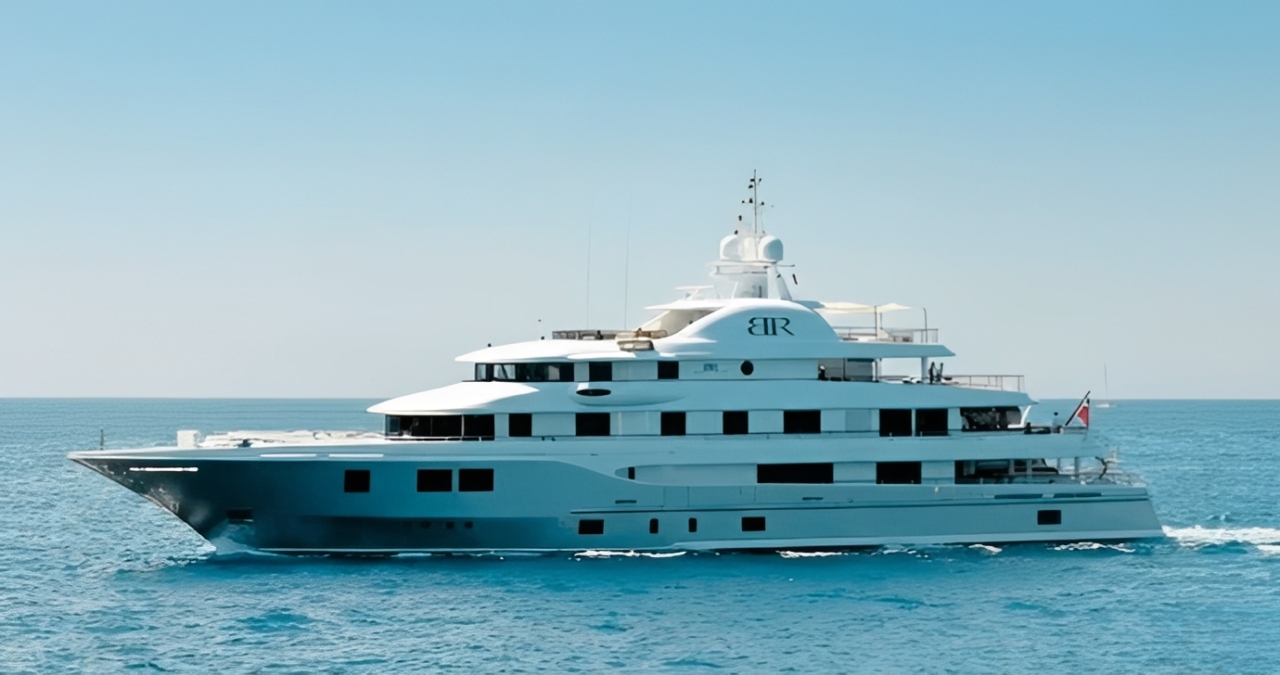 Stunning 205ft Icon yacht sailing in the clear blue Caribbean waters with guests enjoying the deck.