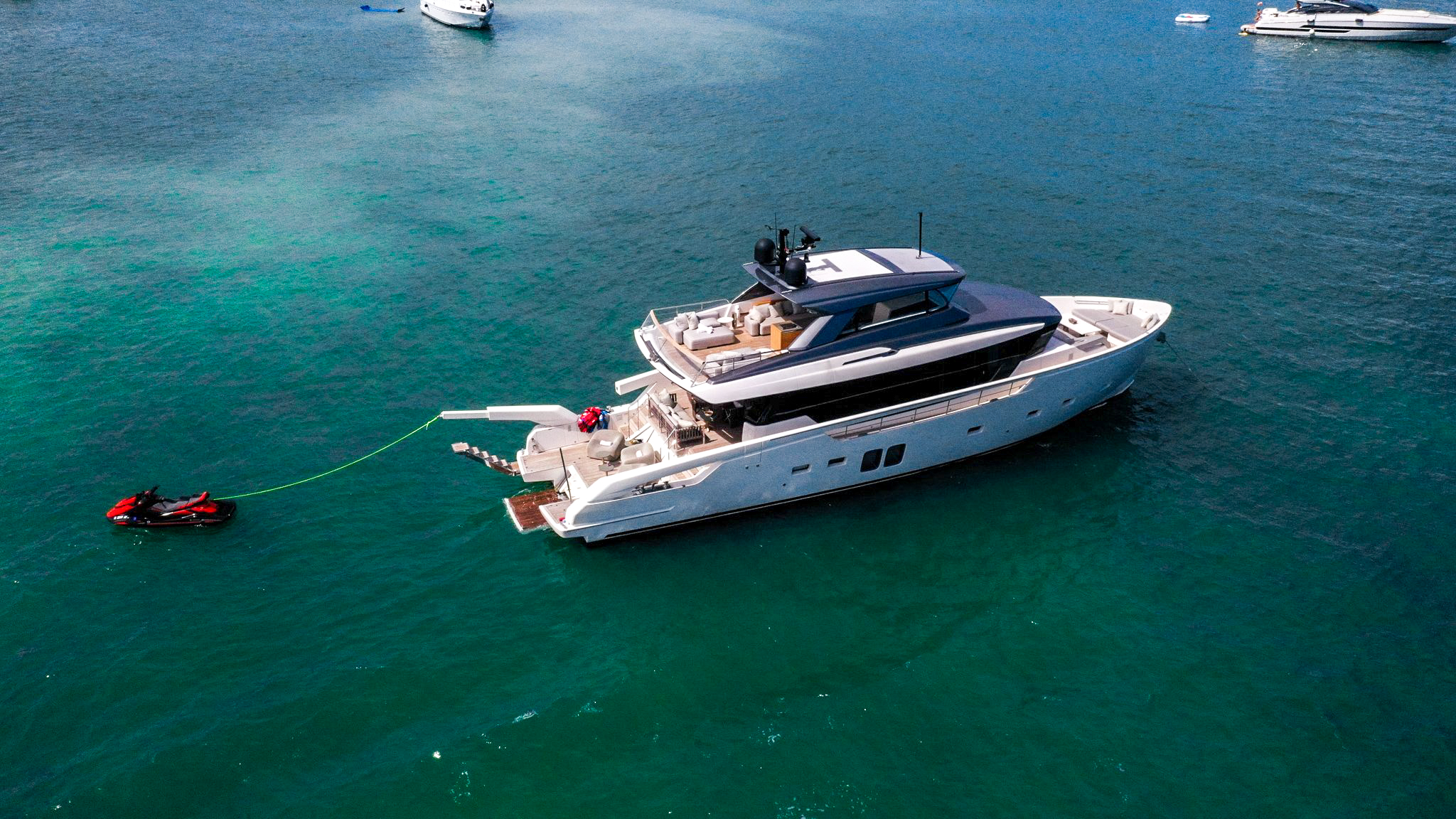 Luxury 76ft San Lorenzo yacht docked in Miami for charter, showcasing Italian design and comfort.