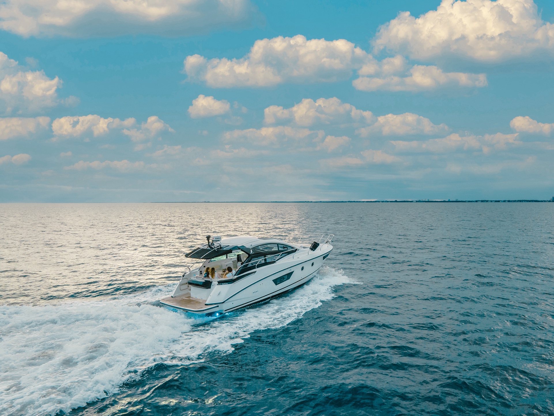 A guest enjoying the sunpad on the foredeck of the 40 Beneteau yacht