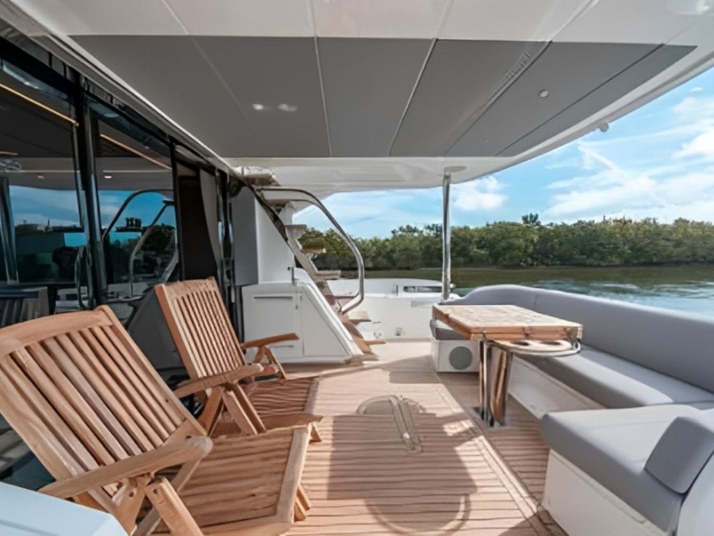 Rear view of the 68 Sunseeker yacht's stern with a swim platform overlooking blue water
