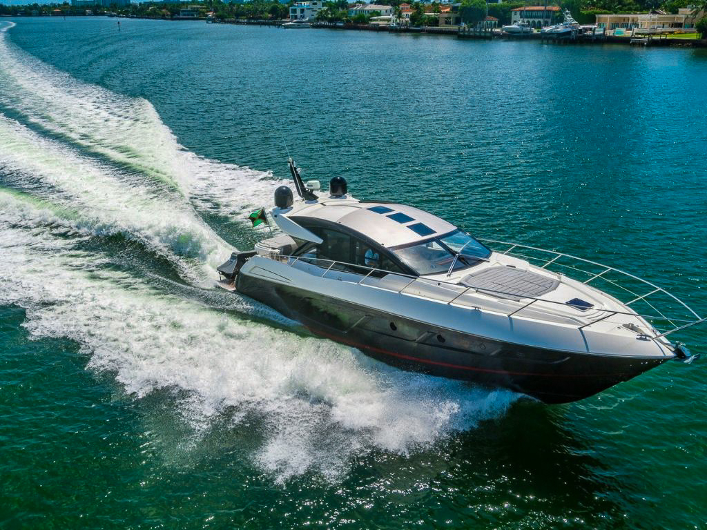 A group enjoying the bow deck of the 57 Sunseeker with sunpads