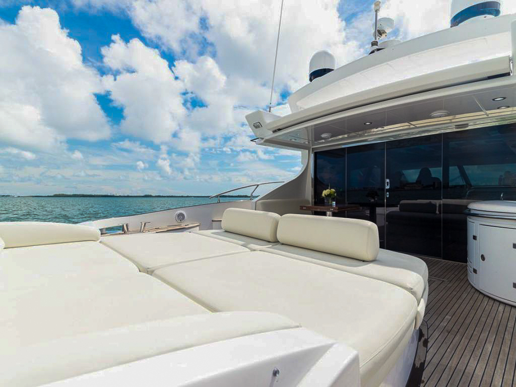 Side view of the 68 Azimut V yacht cruising in Miami