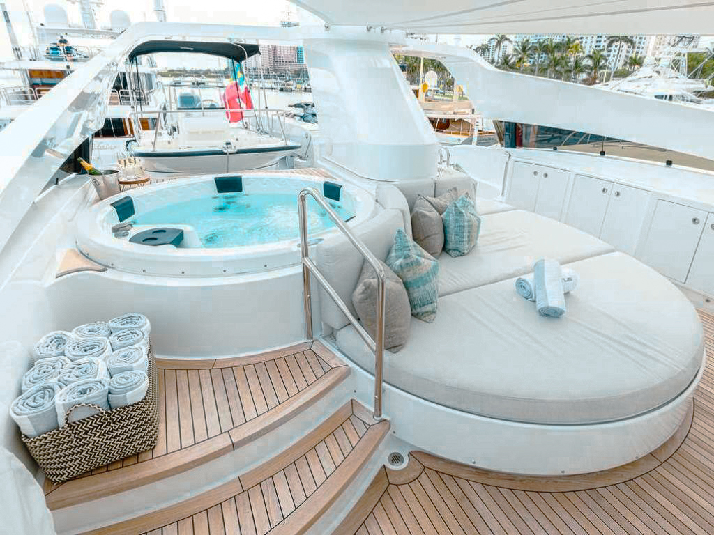 Luxury 123ft Palmer Johnson III yacht charter sailing through clear blue waters in The Bahamas.