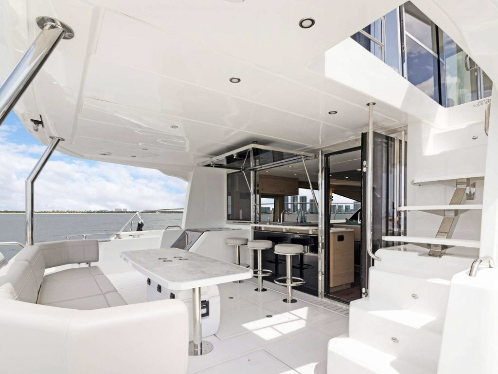 Rear deck of the 54 Aquila with seating and water access