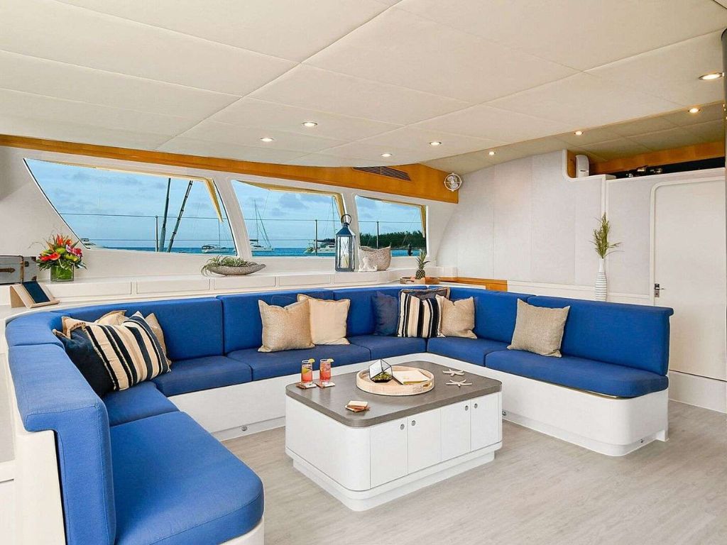 83 Prout yacht cruising in blue water, side view