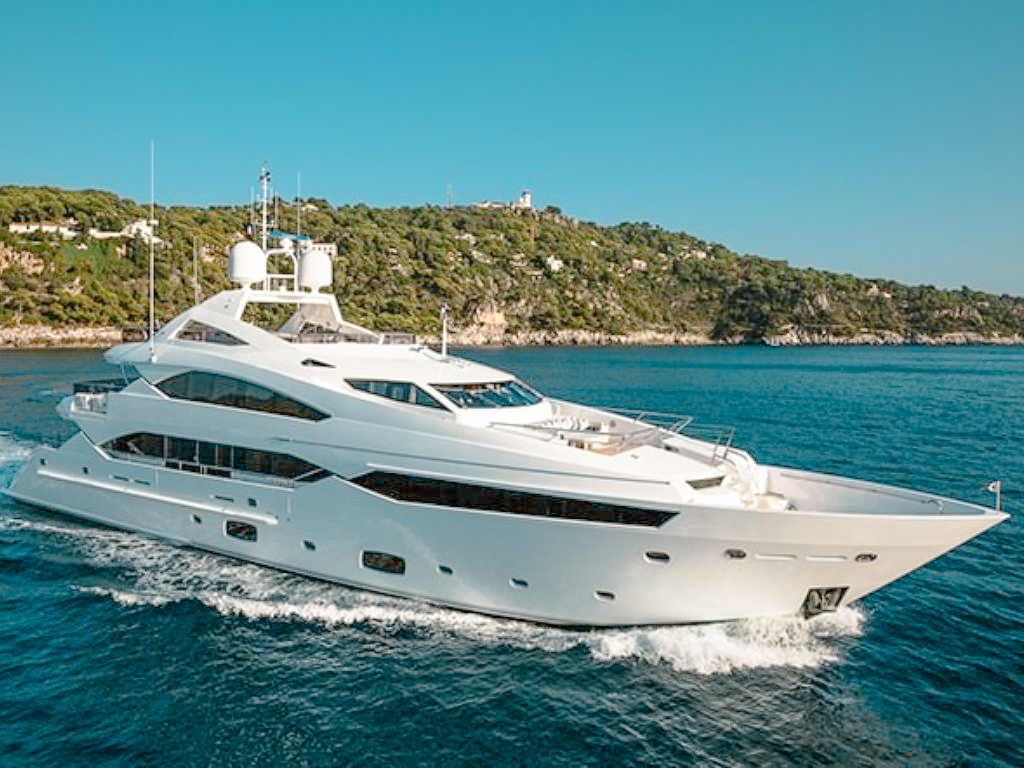 Luxury 132ft Sunseeker yacht sailing on clear blue Caribbean waters for charter.