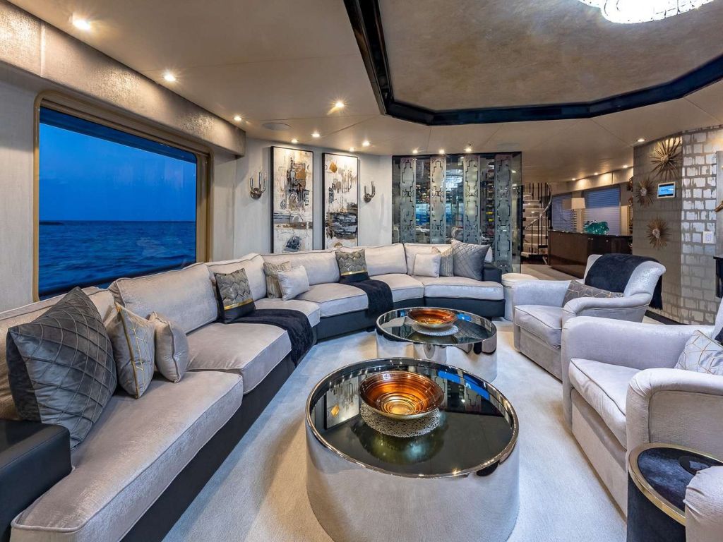 A group enjoying the sun deck and water toys around the 130 Christensen yacht