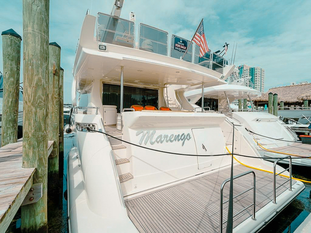 Elegant 85ft Azimut II yacht available for private charter in Miami waters under sunny skies.
