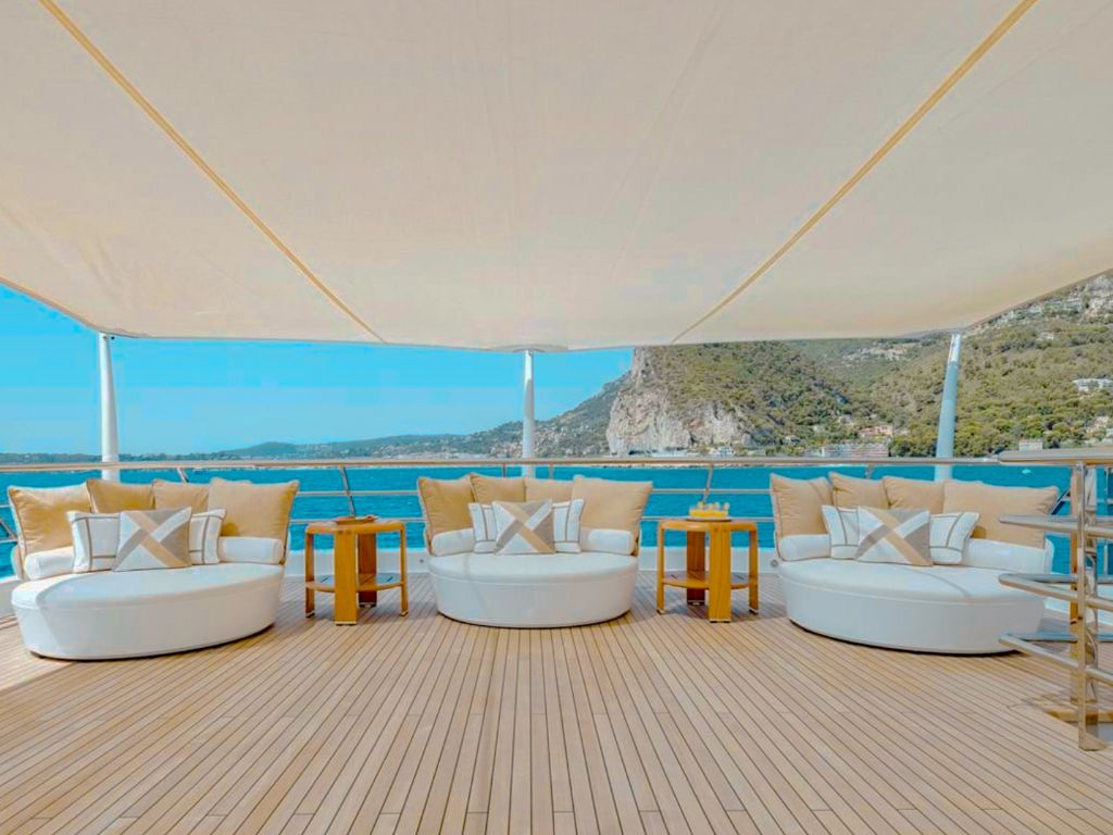 Guests enjoying water toys behind the 180 Amels yacht