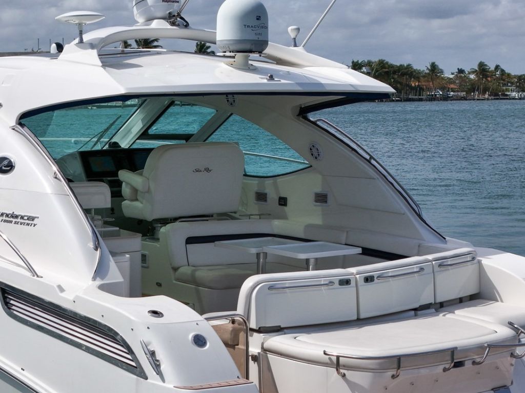 Interior salon area of the 47 Sea Ray yacht with seating and table
