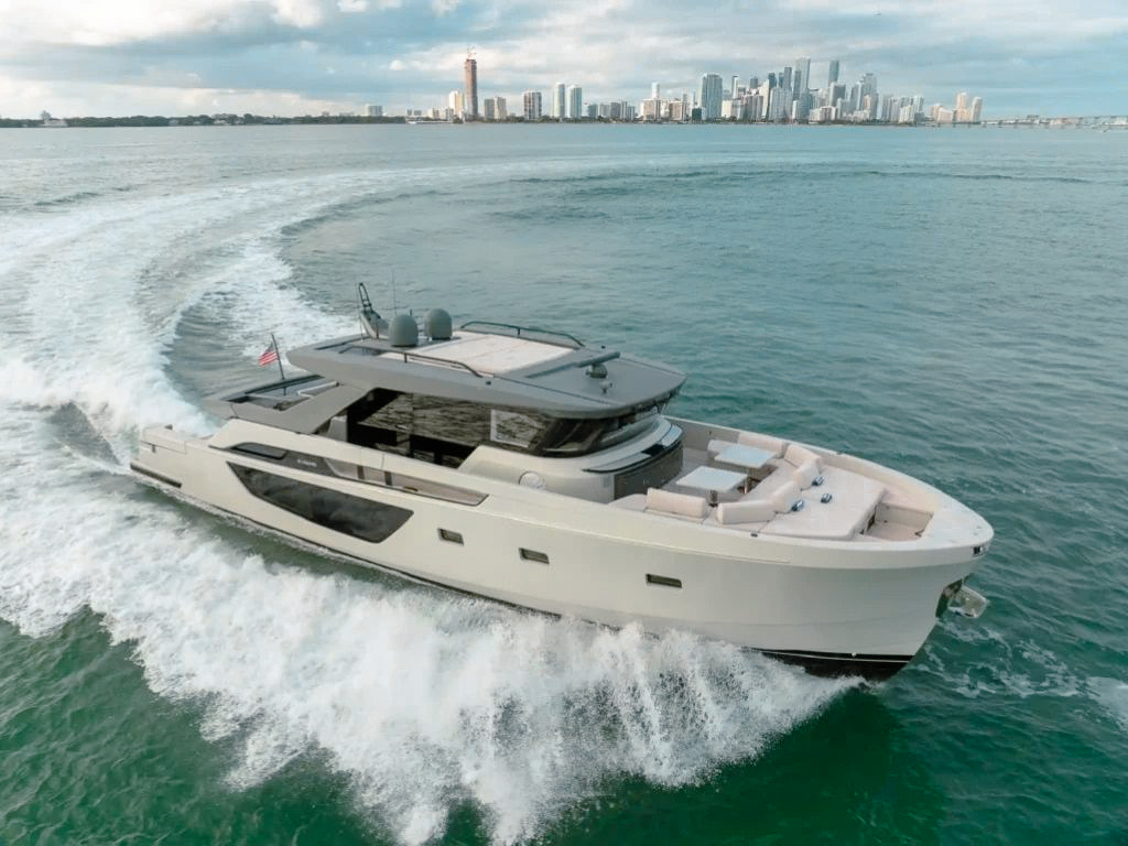 Luxury 72ft Bluegame yacht cruising the waters of Miami for a private charter experience.