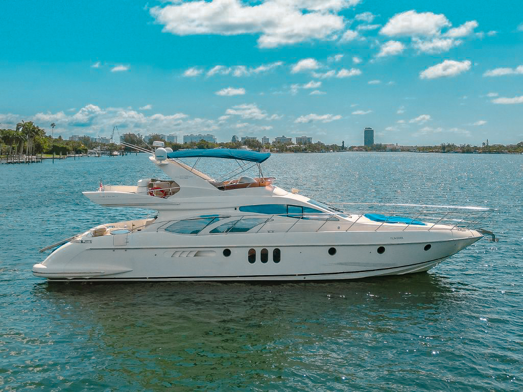 Beautiful 62ft Azimut III yacht docked in Palm Beach, ready for private charter and luxury cruising.