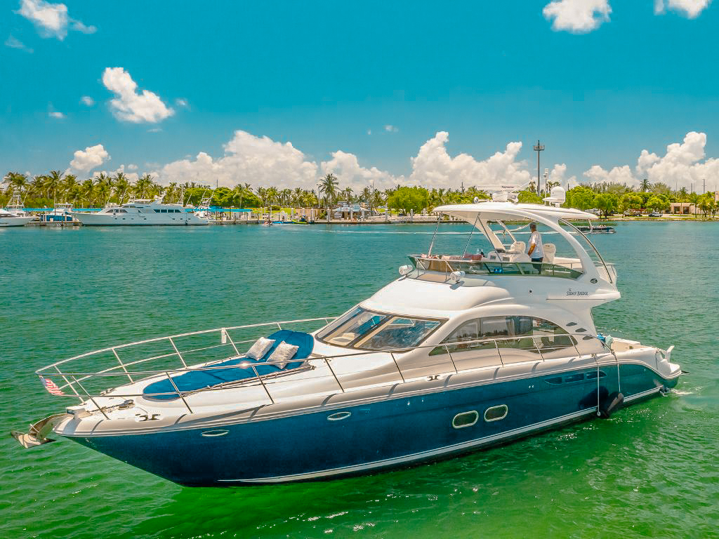 Luxurious 52-foot Sea Ray yacht ready for charter in the sparkling waters of Miami.