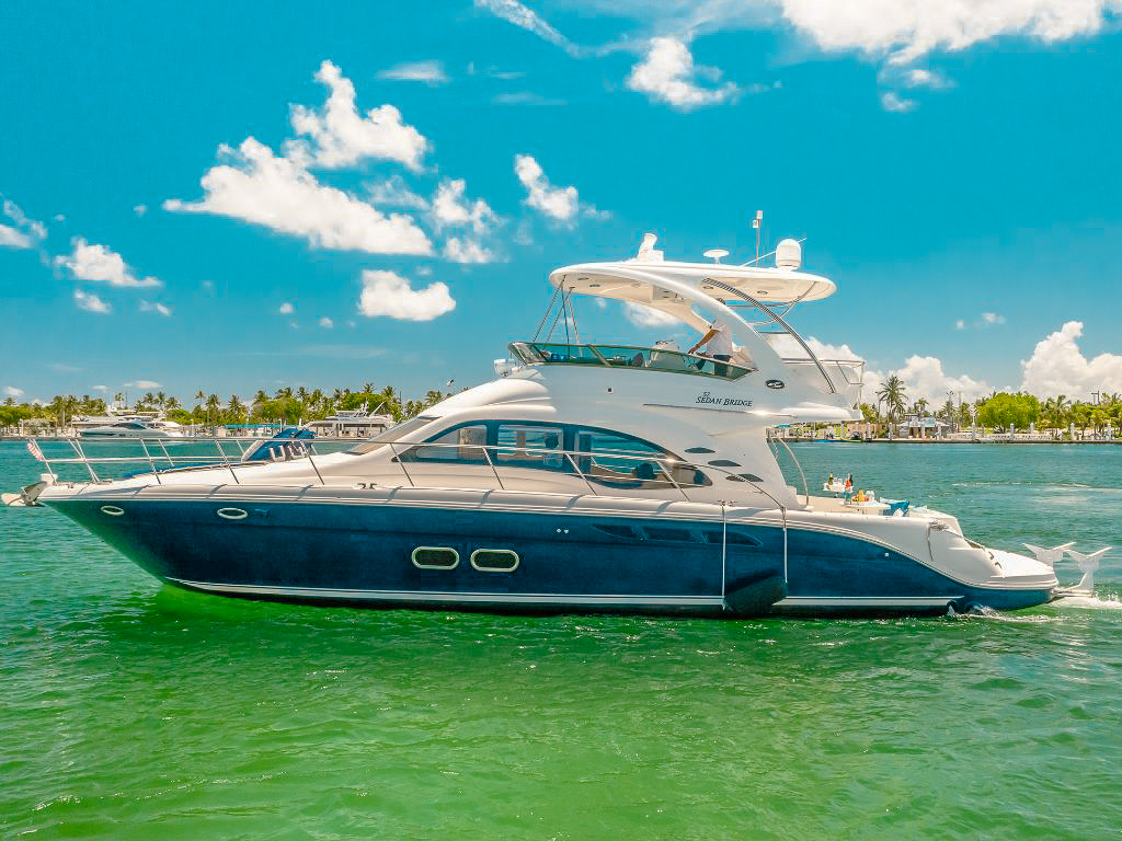 A happy group of friends on the deck of the 52 Sea Ray yacht in Miami