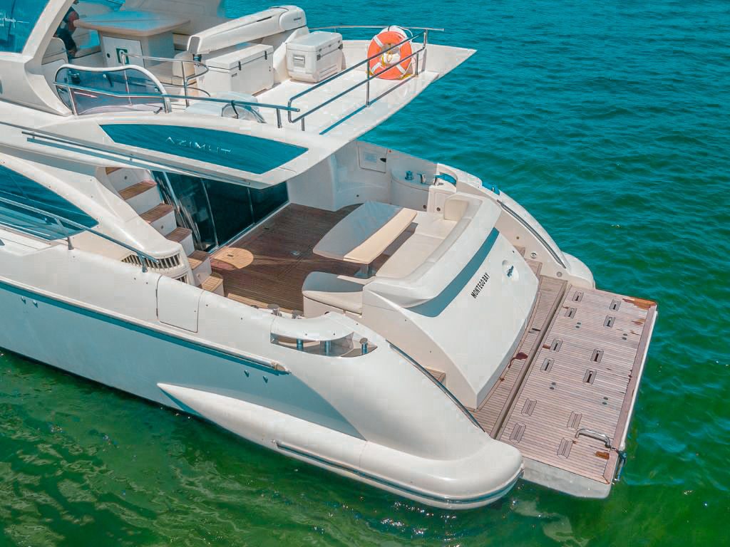 Luxury 84 Azimut yacht cruising crystal clear waters in the Bahamas