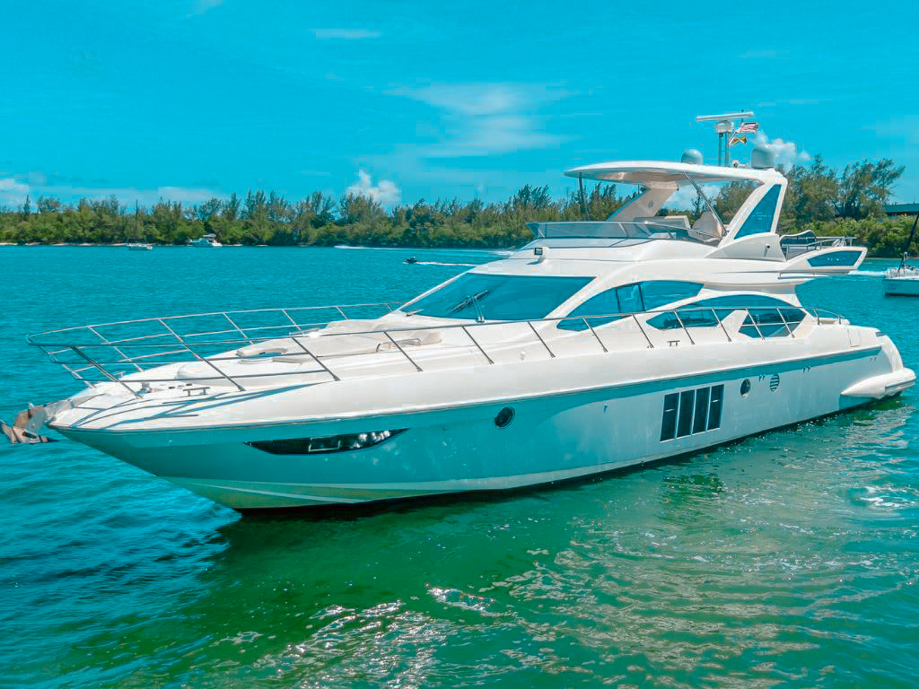 Side view of the 64 Azimut Fly yacht cruising in Miami