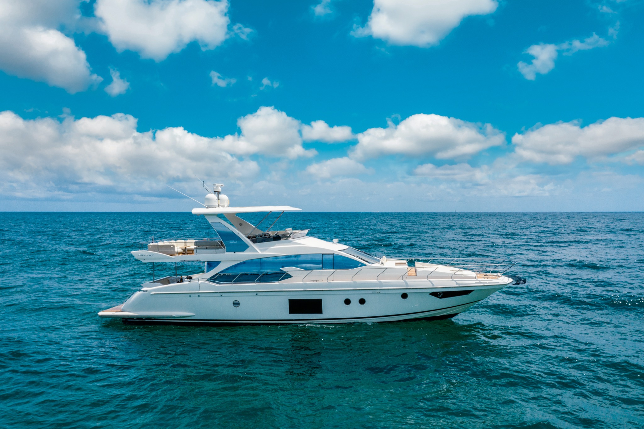 Stunning 70ft Azimut Fly yacht cruising in Miami waters for a luxury charter experience