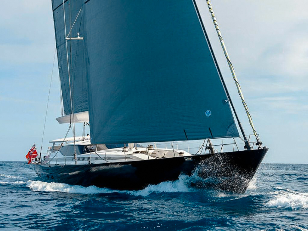 Luxury 131ft Custom Sail Yacht cruising the clear blue waters of the Caribbean.