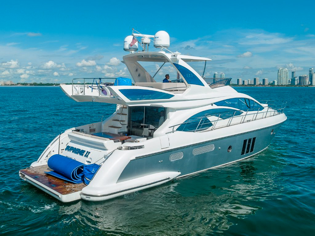 Luxury 70ft Azimut S yacht docked in Miami for charter, offering a premium boating experience.