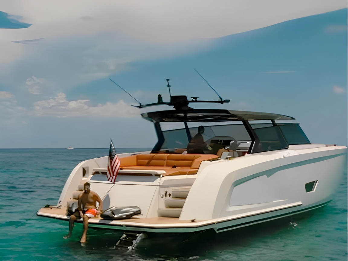 Beautiful 58ft Vanquish III yacht cruising the Miami coastline on a sunny day.
