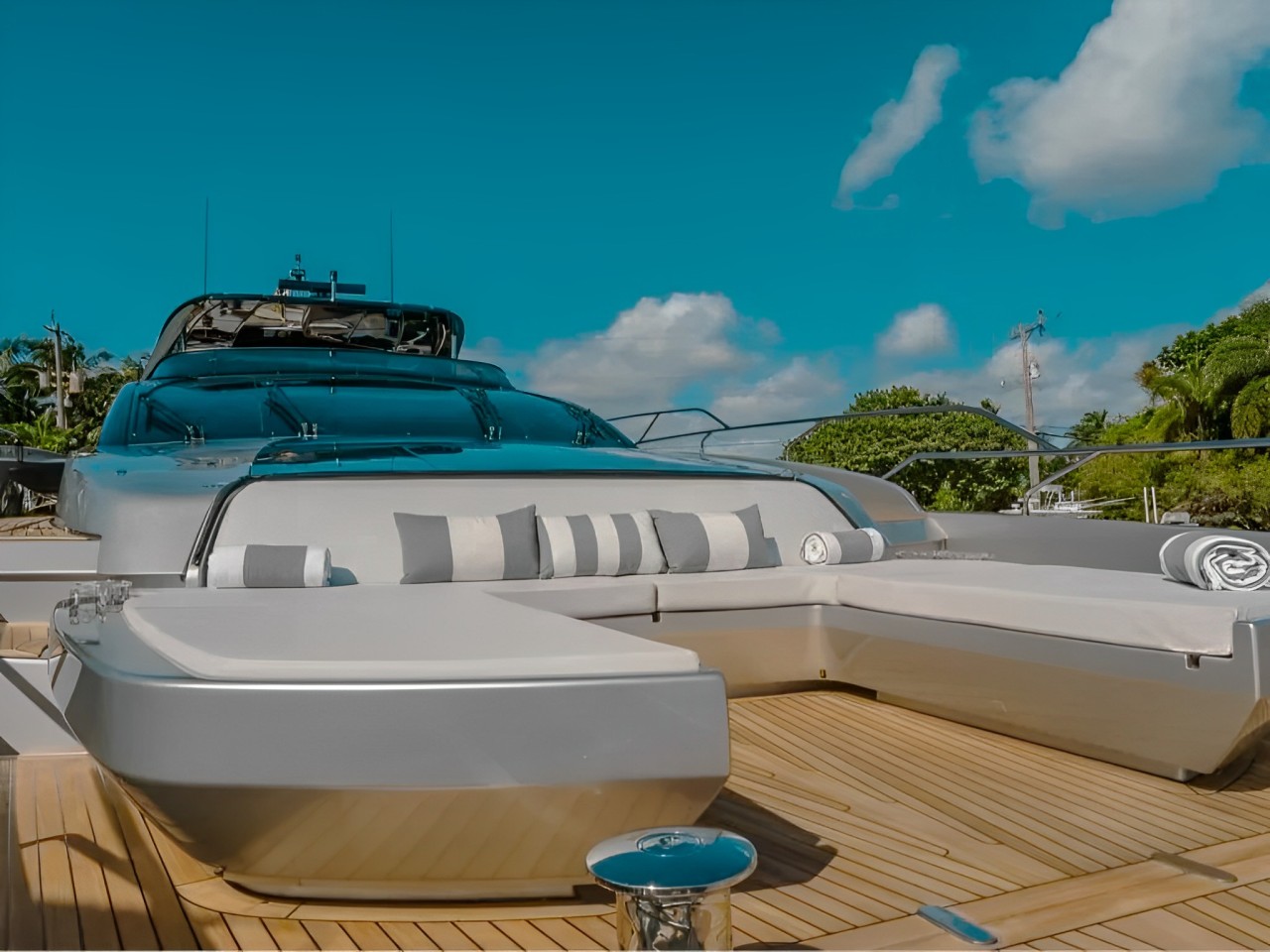 View of the 93 Riva yacht at anchor in crystal clear Bahamian waters