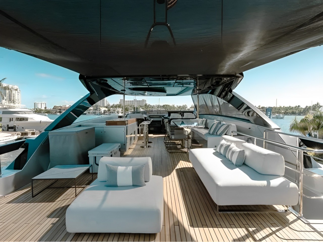 People enjoying water activities from the 93 Riva yacht