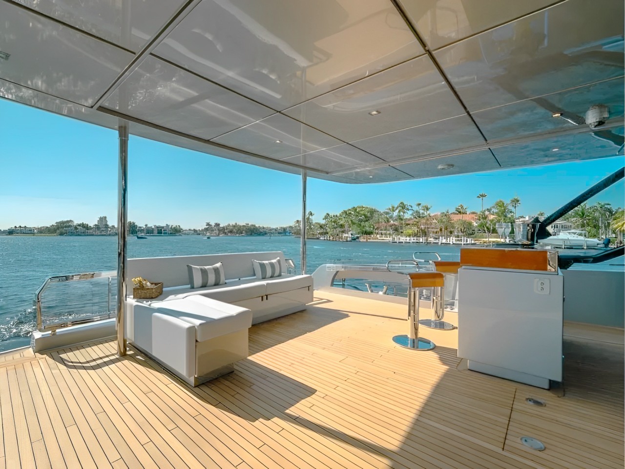 Spacious sun deck with comfortable seating on the 93 Riva yacht