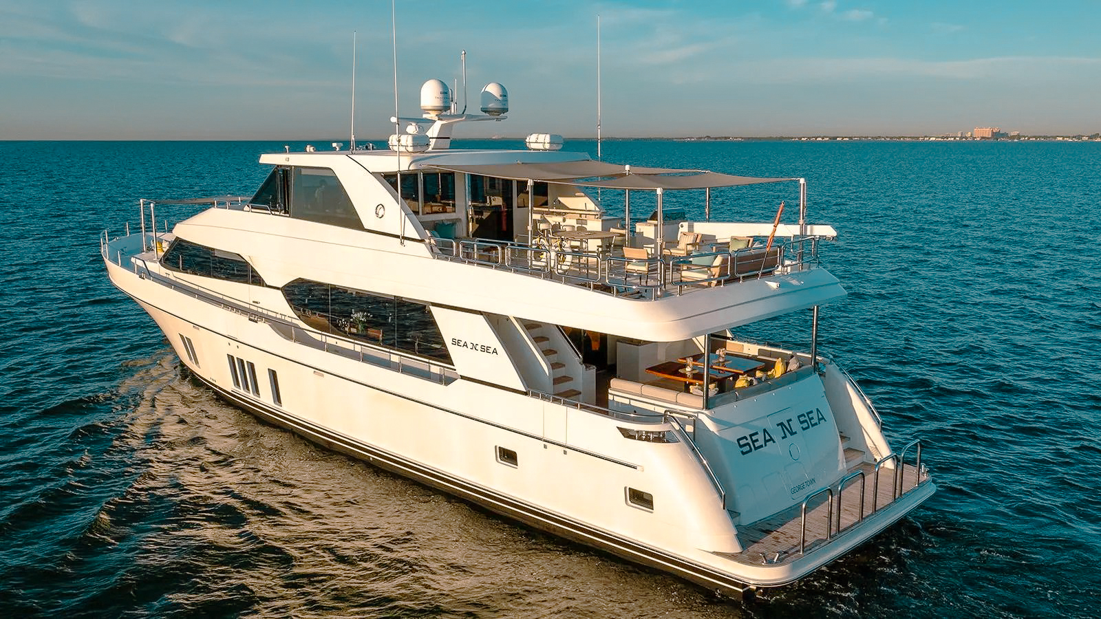 View of the coastline and clear waters from the 100 Ocean Alexander yacht