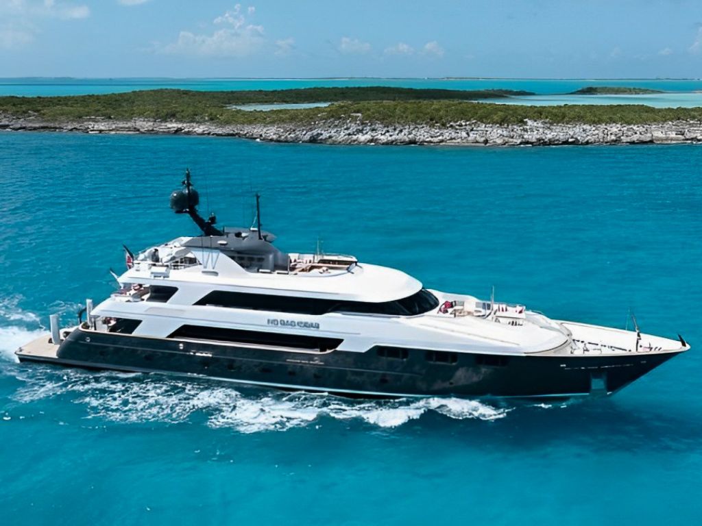 160ft Trinity yacht cruising the crystal clear waters of the Bahamas on a luxury charter.