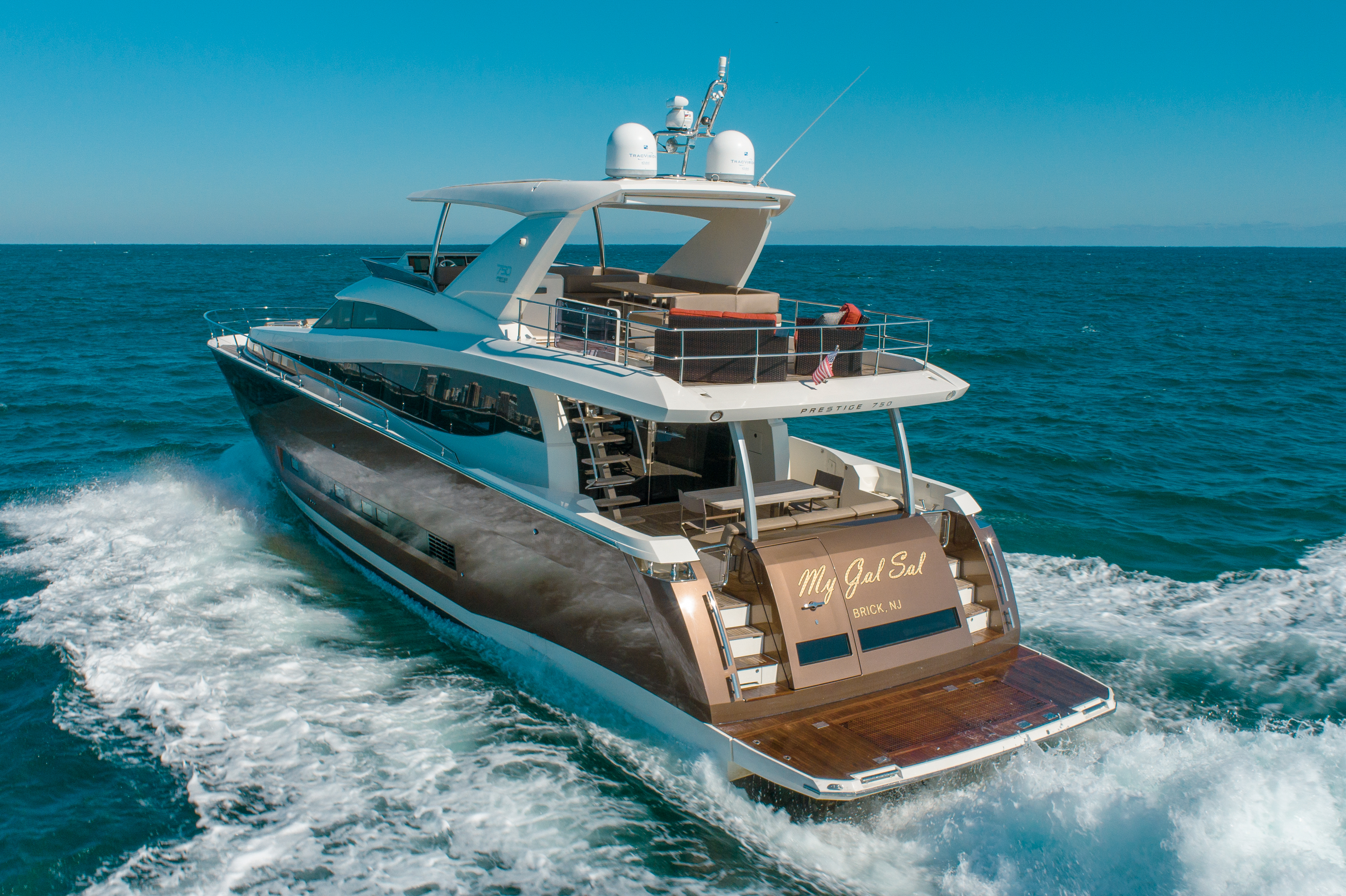 Luxury 75ft Prestige yacht cruising turquoise waters in Miami for charter.
