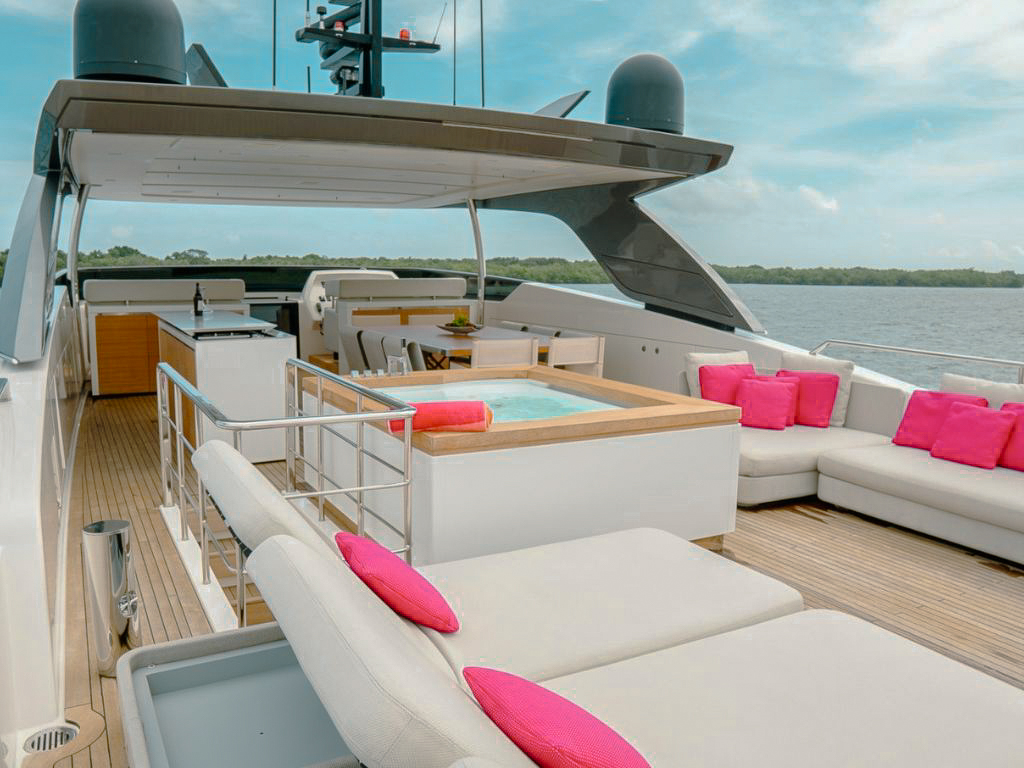 Sun deck of 105 San Lorenzo with lounge chairs and jacuzzi