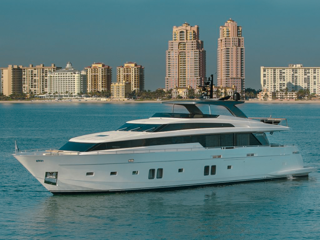 Side view of the 105 San Lorenzo yacht anchored with an amazing view
